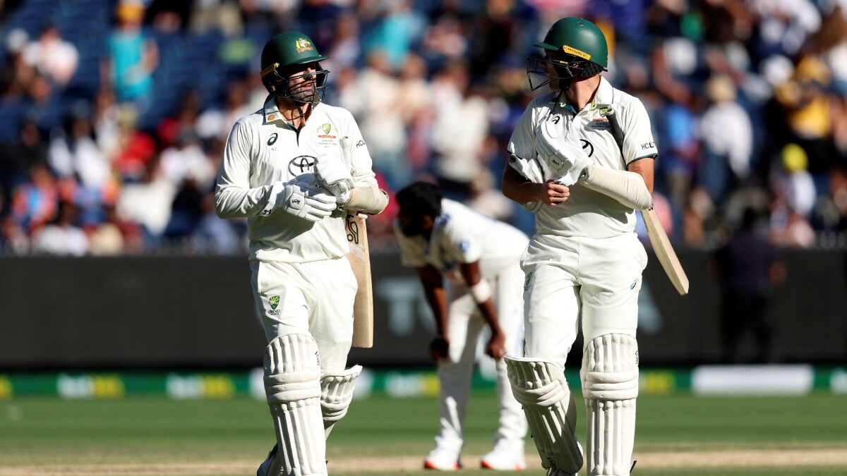 Nathan Lyon (L) and Scott Boland leave the field at the close of play on day four of the fourth cricket Test match between Australia and India | AFP