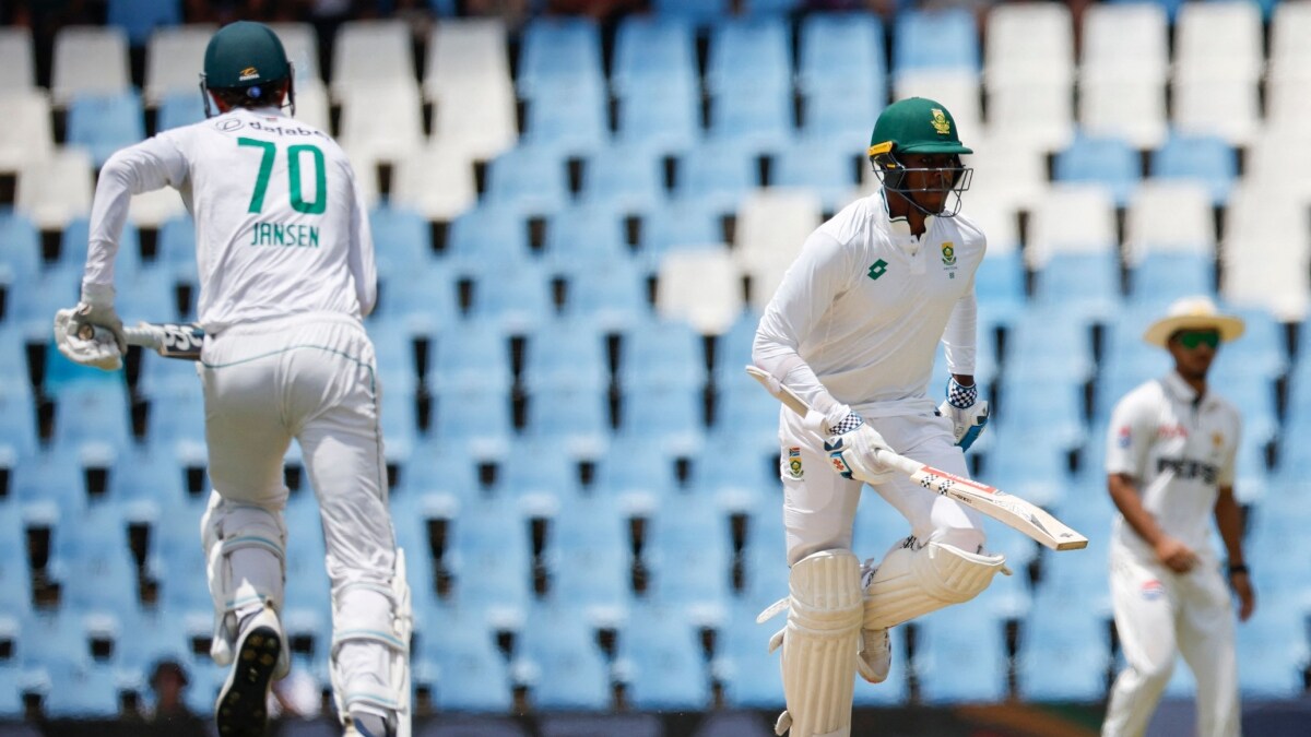 South Africa's Marco Jansen (L) and Kagiso Rabada (C) run between the wickets | AFP
