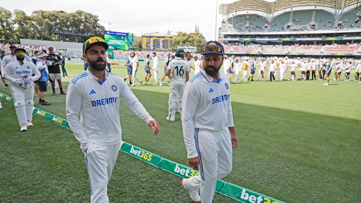 Rohit Sharma and Virat Kohli leave the field after their loss in the second cricket test match against Australia at the Adelaide Oval | AP