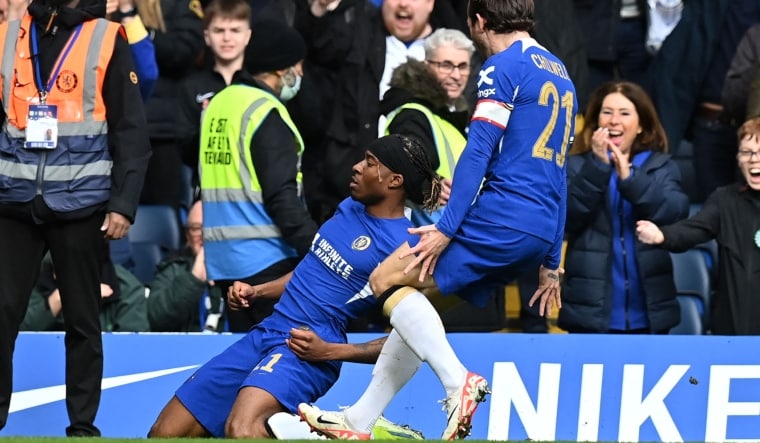 Chelsea's English midfielder Noni Madueke (L) celebrates after scoring their fourth goal | AFP