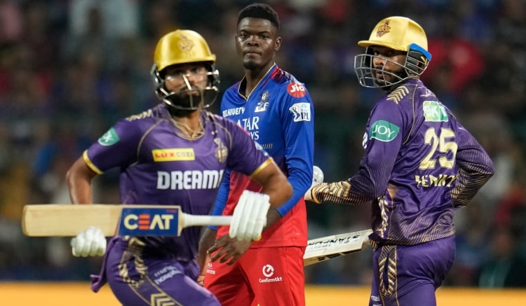 Royal Challengers Bengaluru's Alzarri Joseph watches as Kolkata Knight Riders' Venkatesh Iyer (R) and Shreyas Iyer run between the wickets | AP