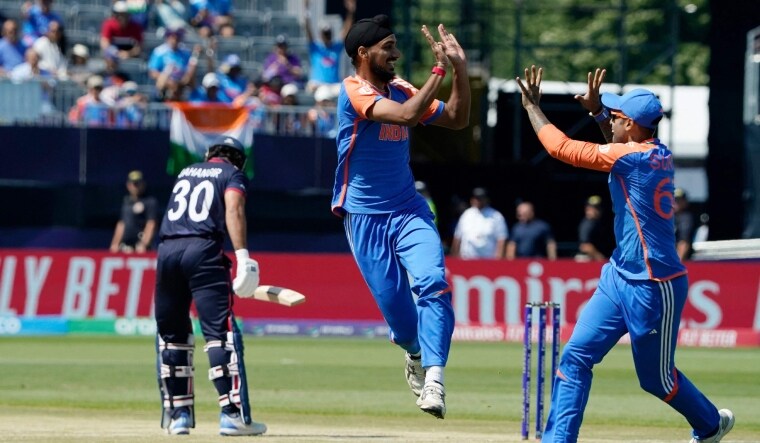 Architects of Indian victory Arshdeep Singh and Suryakumar Yadav celebrate the fall of a US wicket | AFP