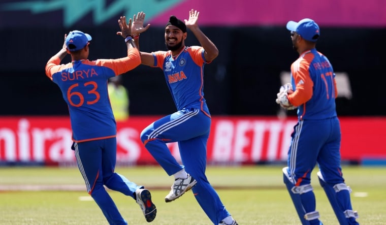 Architects of Indian victory Arshdeep Singh and Suryakumar Yadav celebrate the fall of a US wicket | AFP