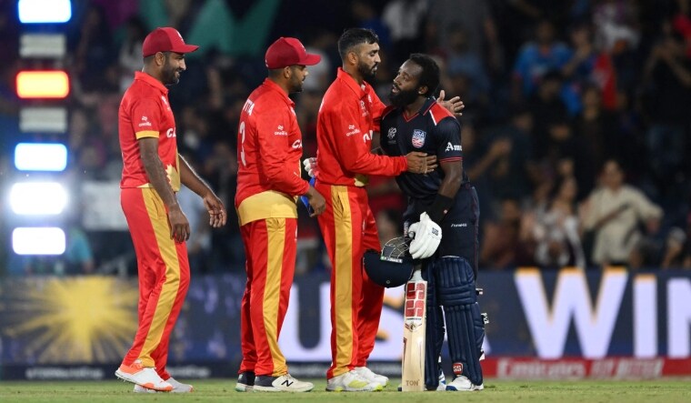 USA's vice-captain Aaron Jones (R) hugs Canada players as he celebrates winning the ICC men's Twenty20 World Cup 2024 group A game | AFP