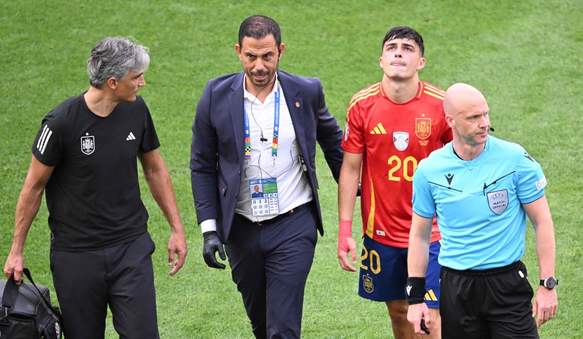 Spain's midfielder Pedri receives medical attention during the UEFA Euro 2024 quarter-final match against Germany | AFP
