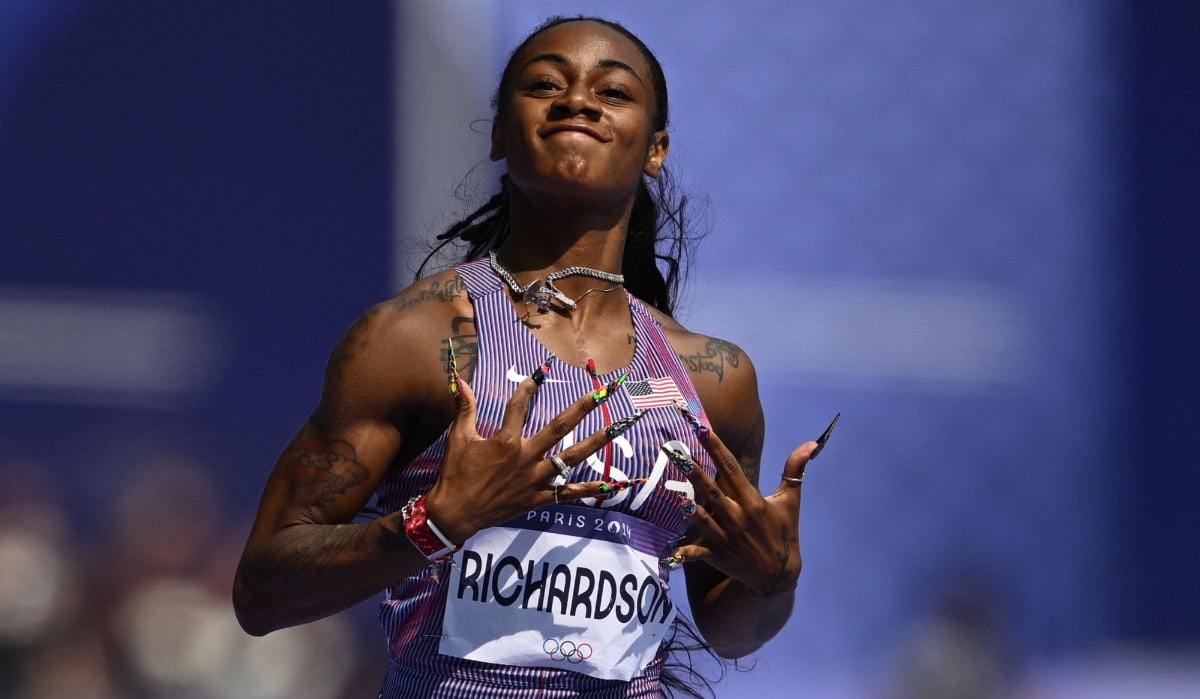 Sha'Carri Richardson of USA celebrates after winning the women's 100m heat of the athletics event at the Paris 2024 Olympic Games | AFP