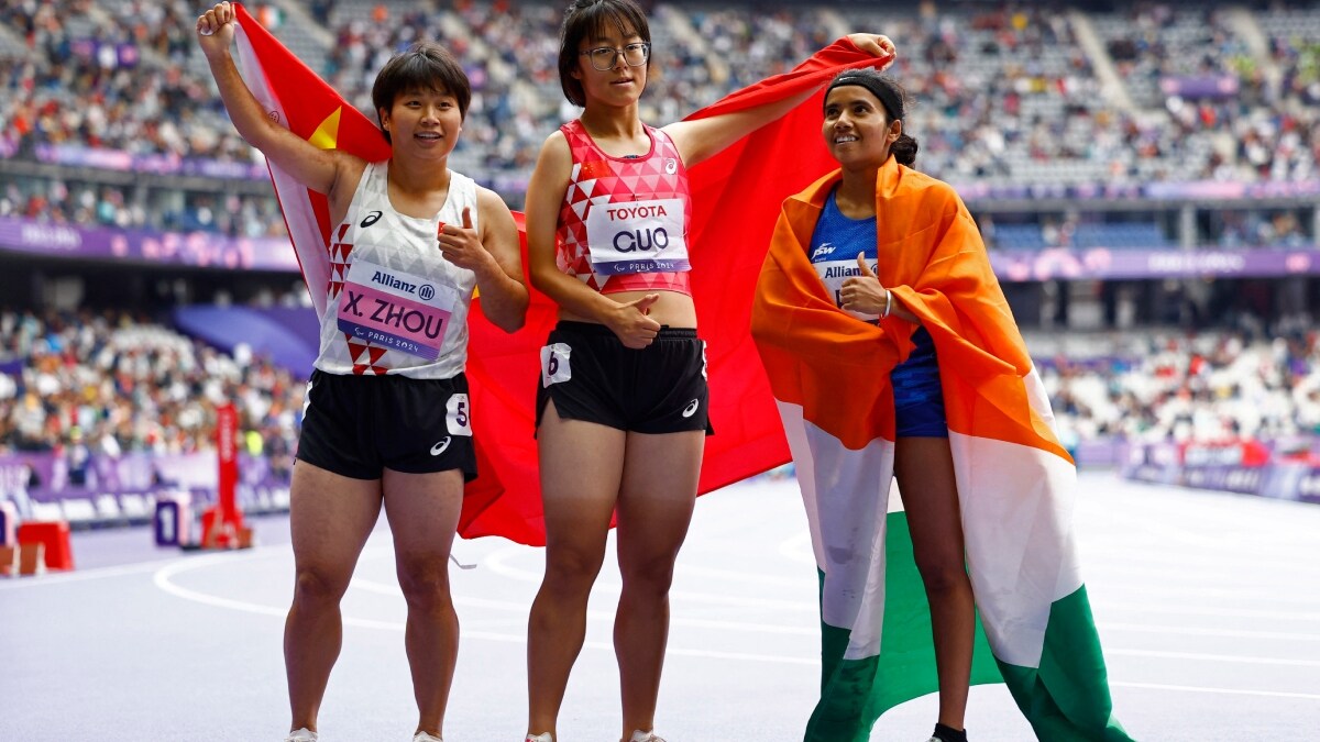 Gold medallist Xia Zhou of China celebrates with silver medallist Qianqian Guo of China and bronze medallist Preethi Pal of India | Reuters
