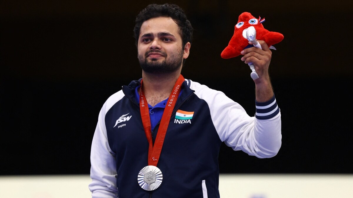India's Manish Narwal poses with his silver medal during the medal ceremony | Reuters