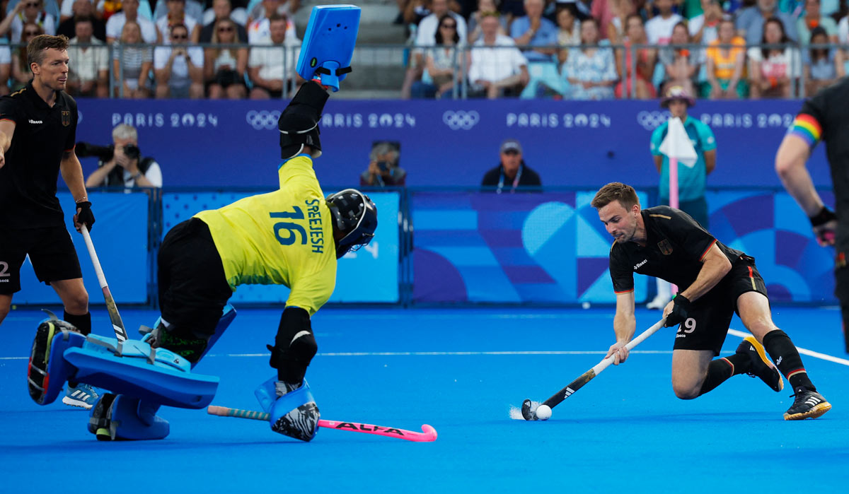 Justus Weigand of Germany in action with P.R. Sreejesh of India | Reuters