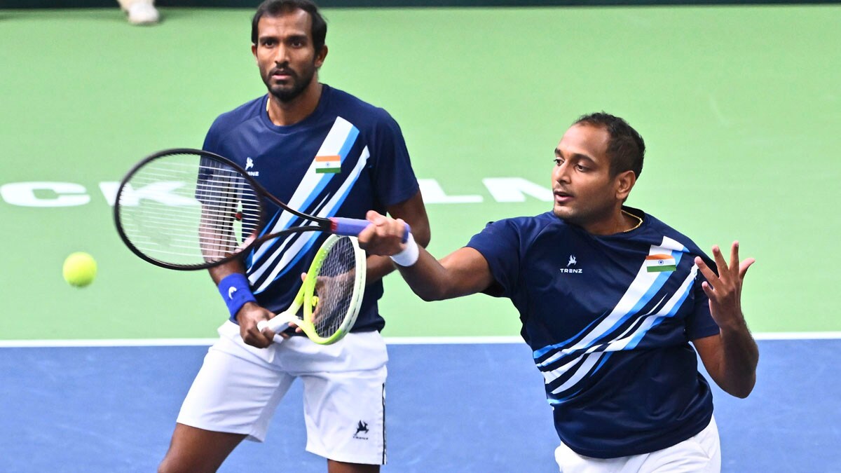 India's Sriram Balaji, left, and Ramkumar Ramanathan play a return to Sweden's Filip Bergevi and Andre Goransson during the men's doubles match in the Davis Cup between Sweden and India in the Royal Tennis Hall, Stockholm, Sunday Sept. 15, 2024. (Claudio Bresciani/TT via AP)