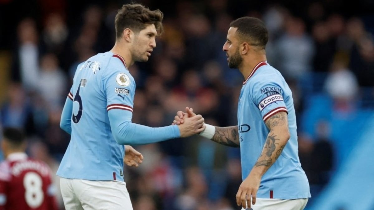 [FILE] Manchester City captain Kyle Walker (R) with John Stones
