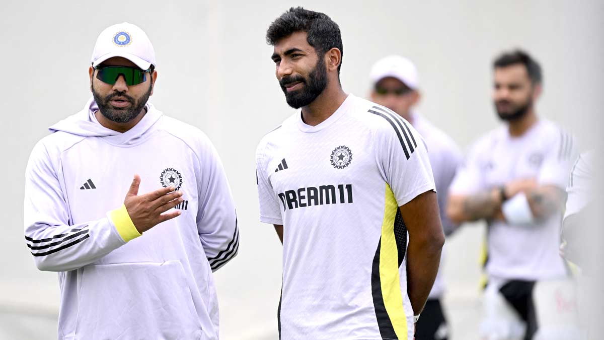 Rohit Sharma (L) chats with Jasprit Bumrah during a practice session ahead of the fifth Test match between Australia and India at the Sydney Cricket Ground | AFP