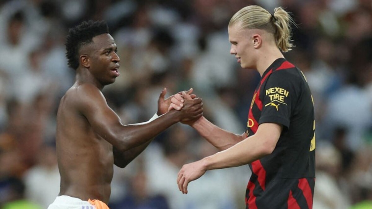 [FILE] Vinicius Jr with Erling Haaland | Reuters