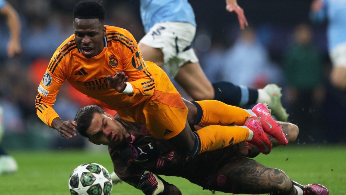 Real Madrid's Vinicius Junior in action with Manchester City's Ederson | Reuters