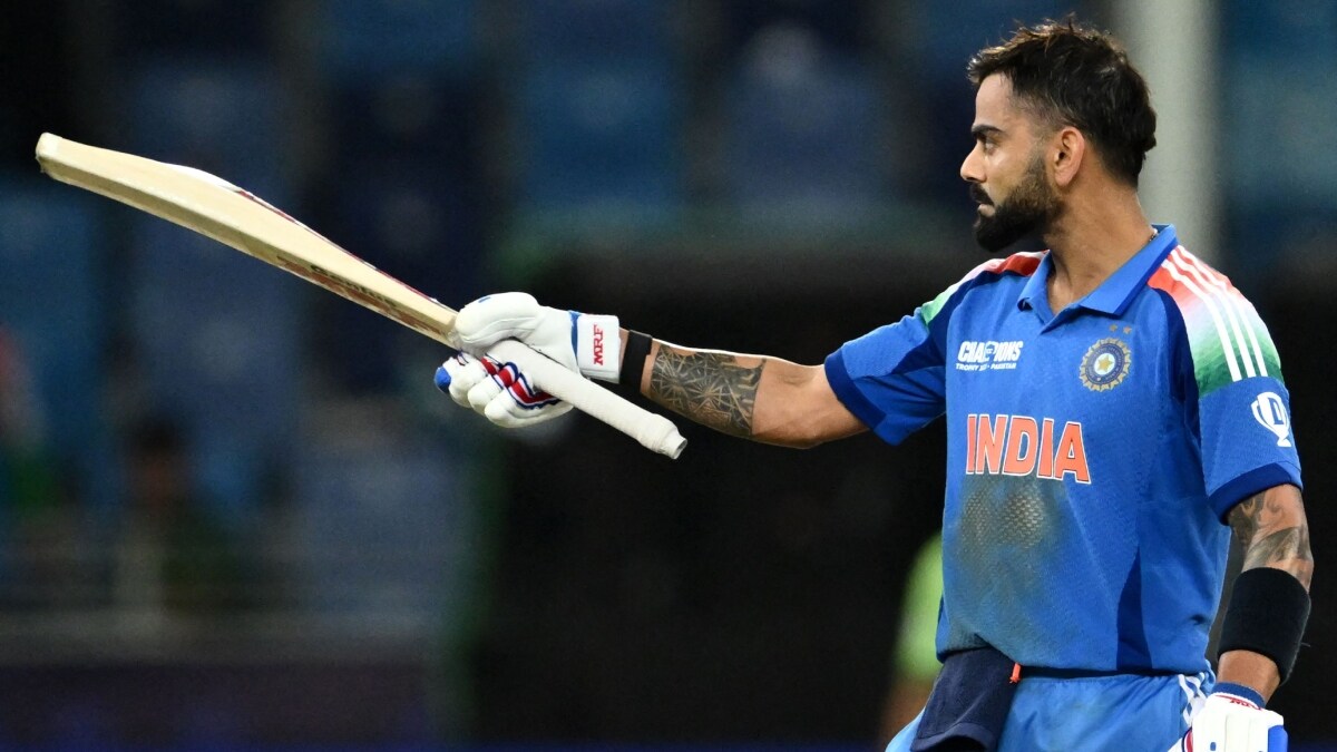 India's Virat Kohli celebrates after scoring century against Pakistan | AFP