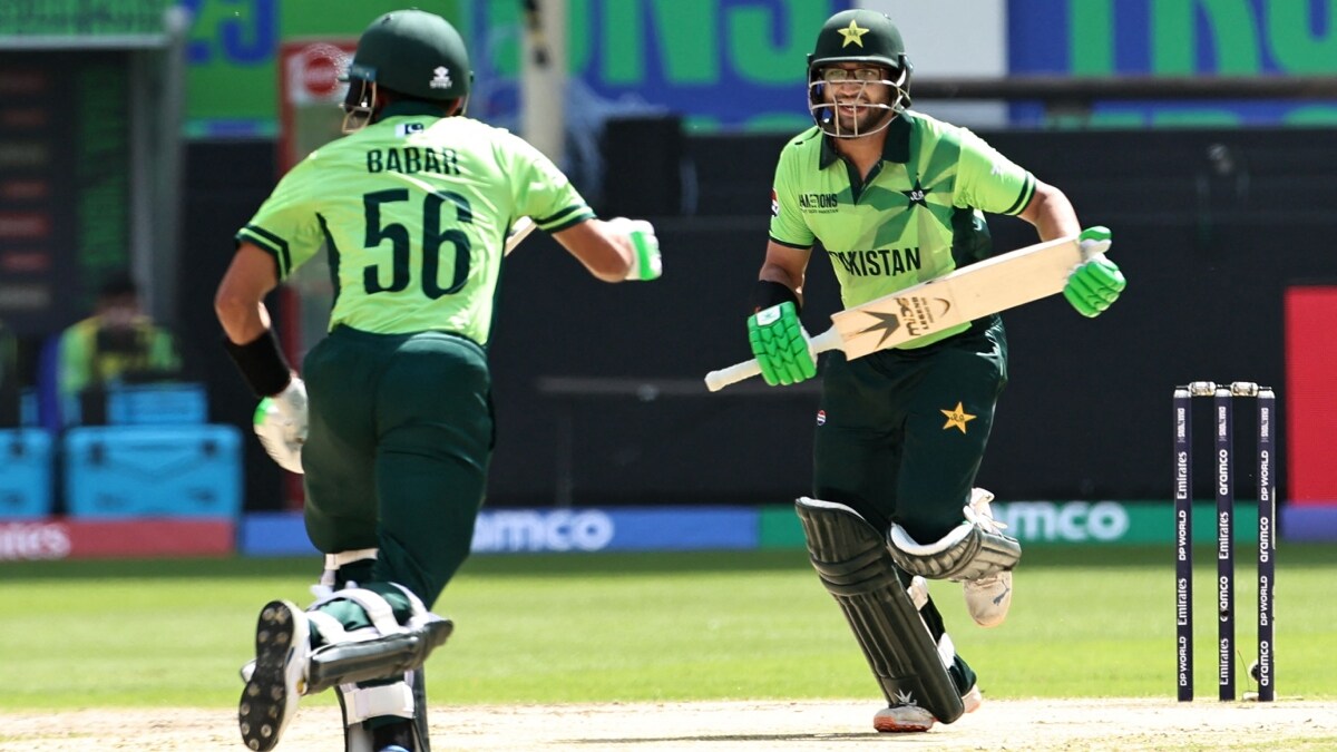 Pakistan's Imam-ul-Haq (R) and Babar Azam run between the wickets during the ICC Champions Trophy one-day international (ODI) cricket match against India at the Dubai International Stadium | AFP


