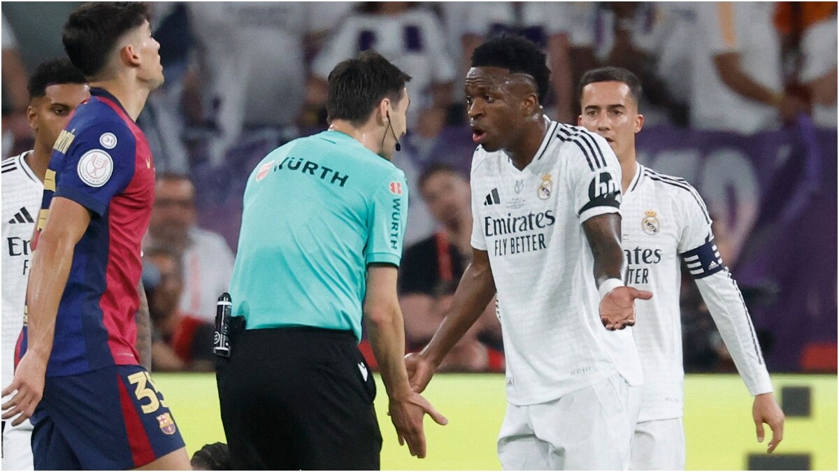 Lucas Vazquez (R) and Rodrygo (L) seen behind Vinicius Jr of Real Madrid | AFP