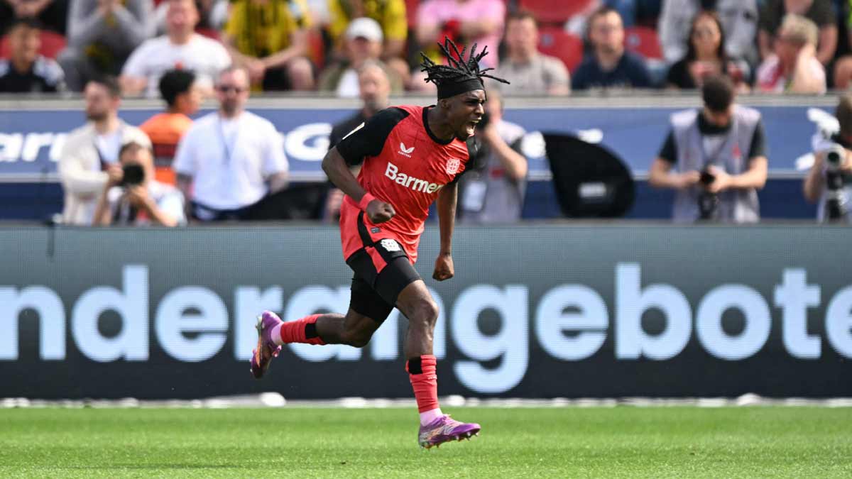 Bayer Leverkusen's Jeremie Frimpong celebrates during the German first division Bundesliga match against Borussia Dortmund in Leverkusen | AFP