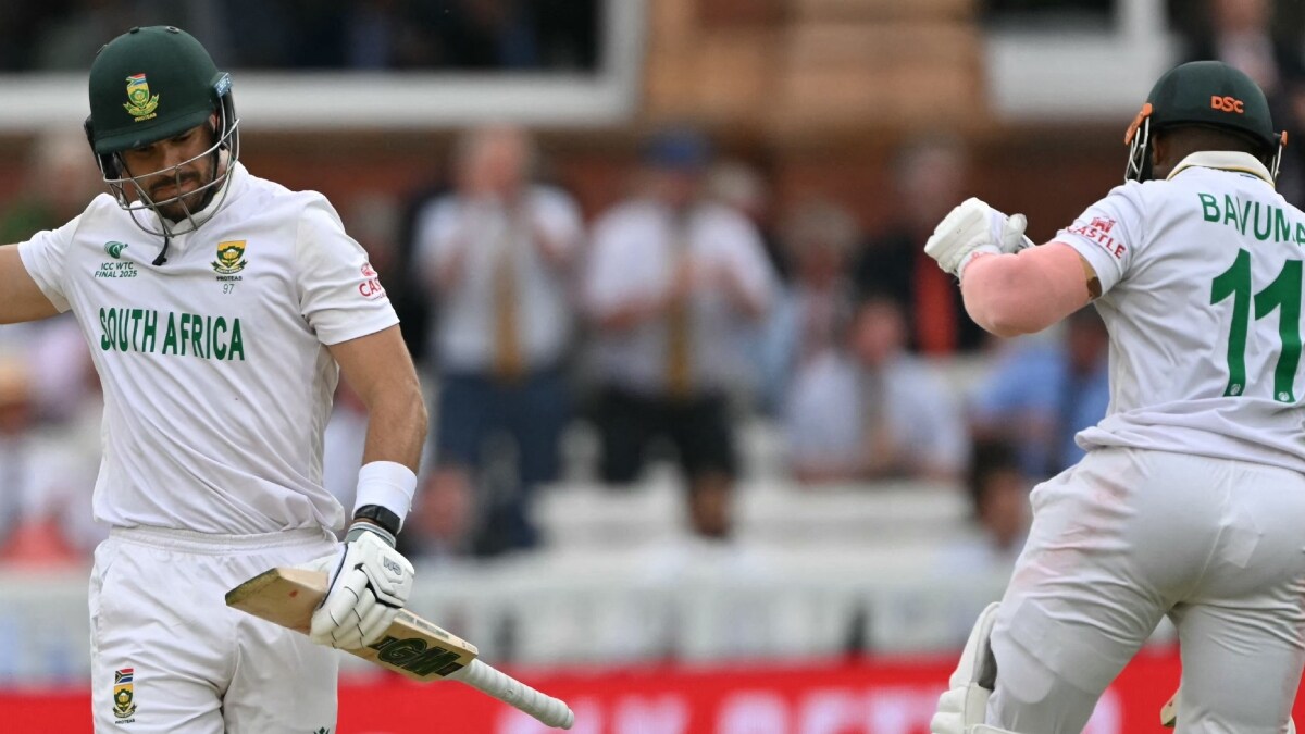 South Africa's Aiden Markram (L) and South Africa's captain Temba Bavuma (R) react after Markram reaches his century | AFP