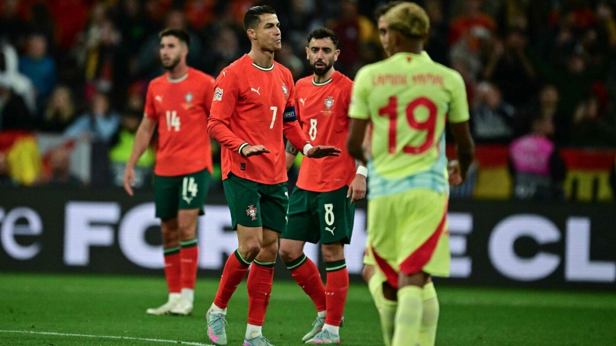 Portugal's Cristiano Ronaldo (C) reacts after scoring the 2-2 goal in front of Spain's  Lamine Yamal (R) during the UEFA Nations League final | AFP