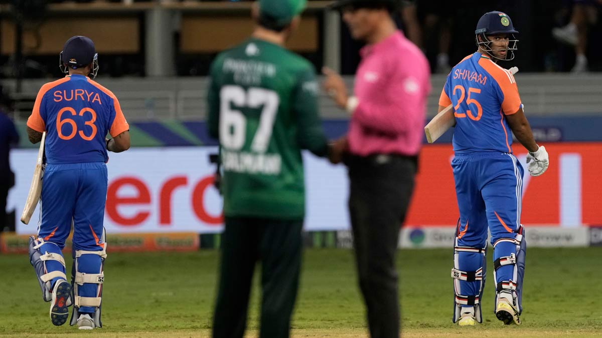 India captain Suryakumar Yadav (left) and Shivam Dube leave the field after their win in the Asia Cup match against Pakistan at Dubai International Cricket Stadium | AP