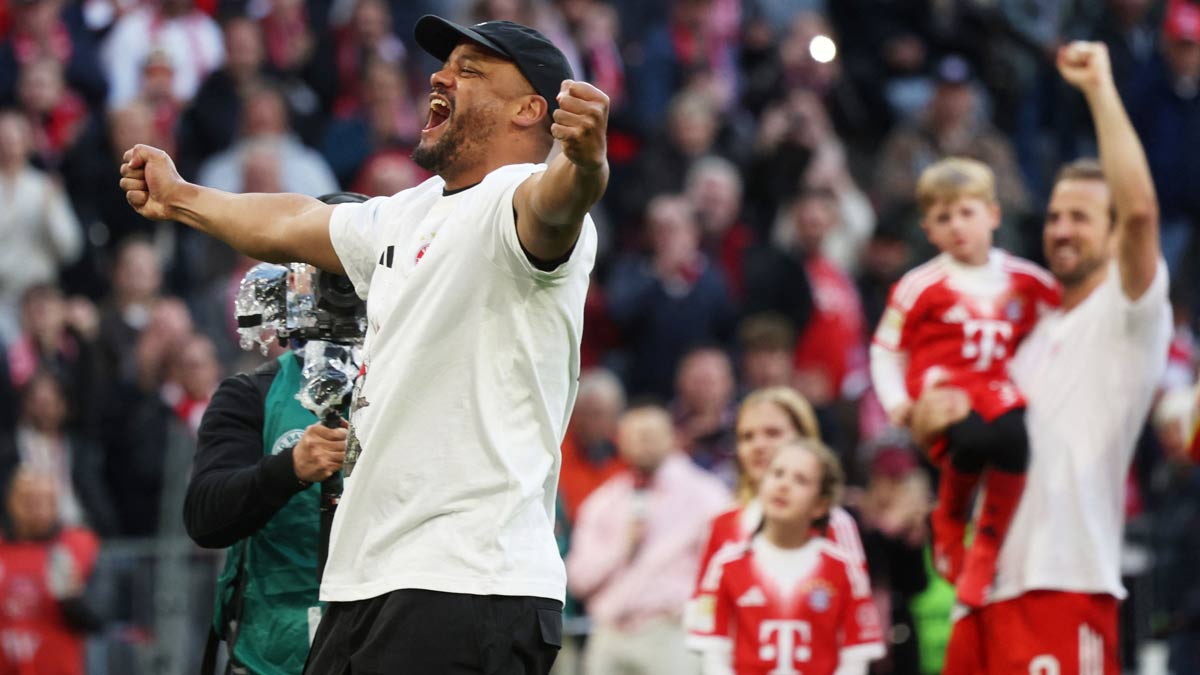 Bayern Munich's head coach Vincent Kompany (L) and forward Harry Kane (R) celebrate after winning the Bundesliga match against VfB Stuttgart as well as the title in Munich | AFP