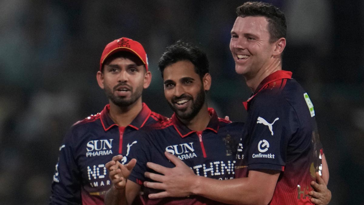 Royal Challengers Bengaluru's Bhuvneshwar Kumar, centre, celebrates with Josh Hazlewood and Jitesh Sharma the wicket of Delhi Capitals' Tristan Stubbs during the IPL match in Delhi | AP