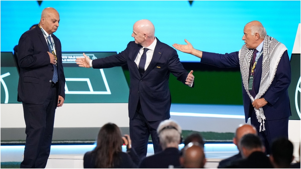 Palestinian Football Association President Jibril Rajoub, right, refuses to stand together with Israel Football Association Vice-President Basim Sheikh Suliman | AP