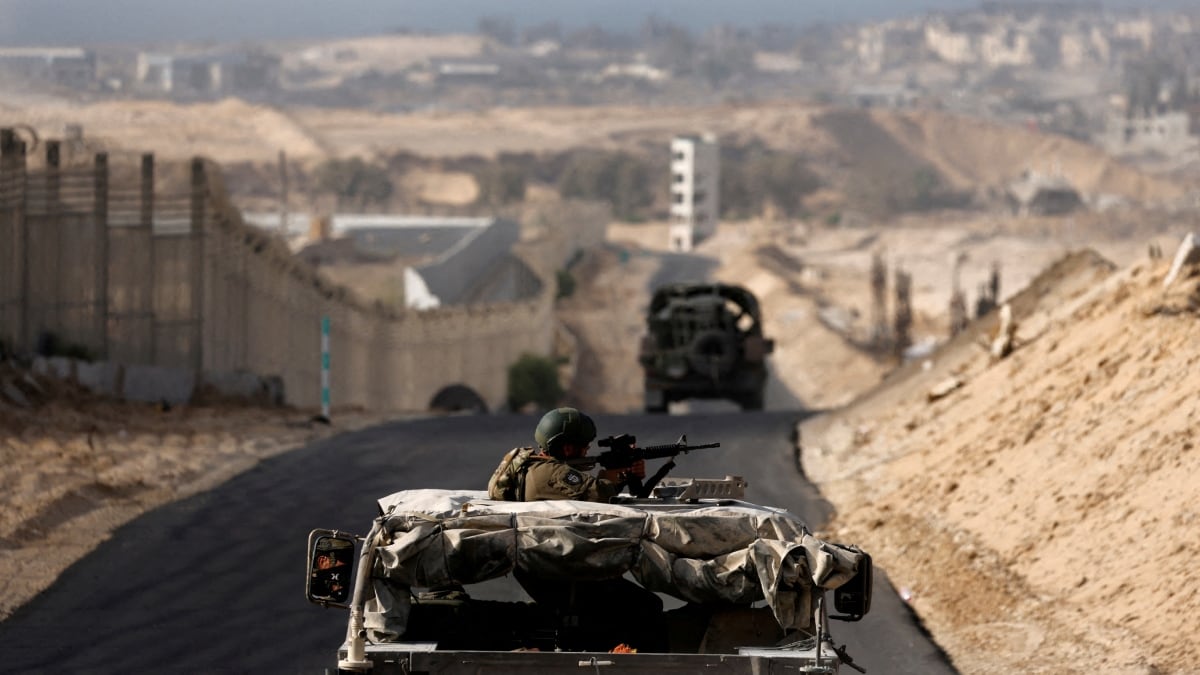 Israeli military vehicles drive through the so-called Philadelphi corridor in southern Gaza | Reuters