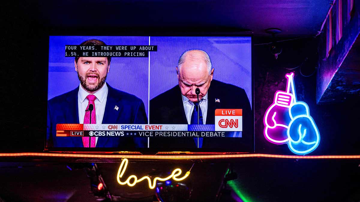 U.S. vice presidential debate plays on bar televisions in New York City. Republican vice presidential nominee J D Vance faces Democrat Tim Walz | AFP