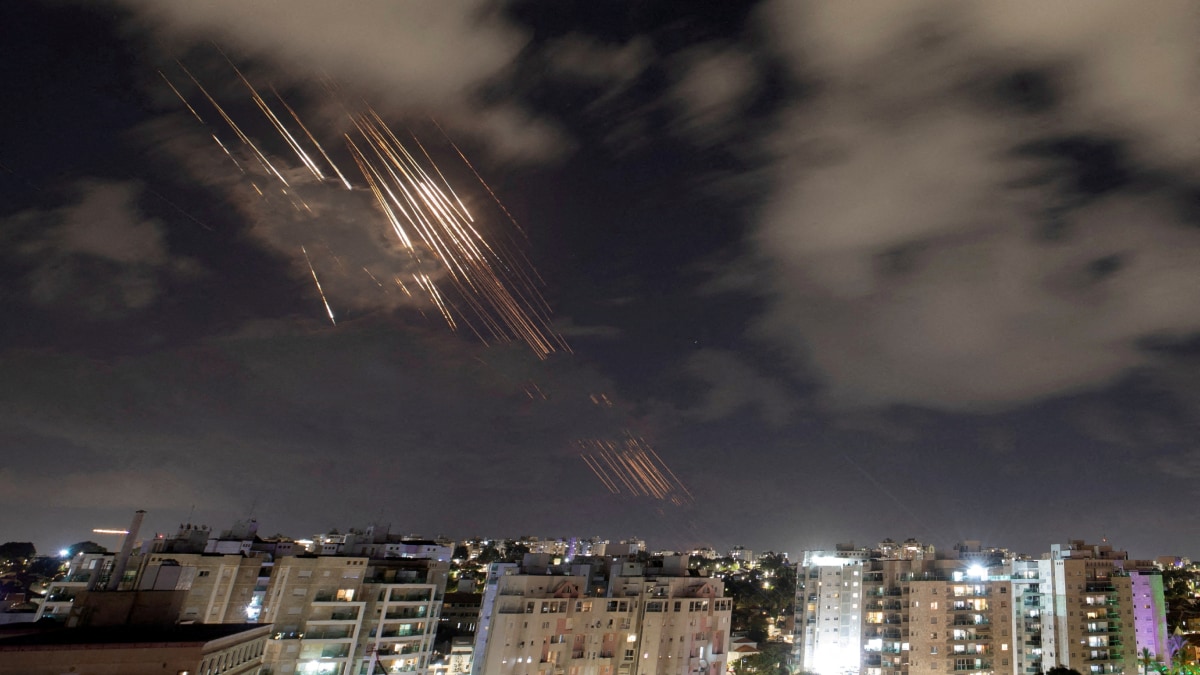 Israel's Iron Dome anti-missile system intercepts rockets after Iran fired a salvo of ballistic missiles | Reuters