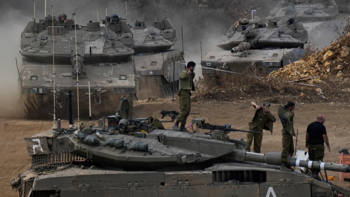 Israeli army tanks maneuver in a staging area in northern Israel near the Israel-Lebanon border | AP