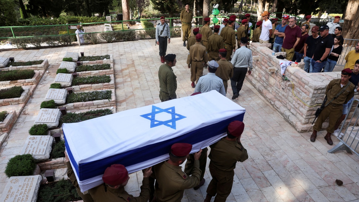 Pallbearers carry the casket of Israeli soldier Captain Eitan Itzhak Oster, who was killed fighting in Lebanon, during his funeral at Mount Herzl military cemetery in Jerusalem | Reuters