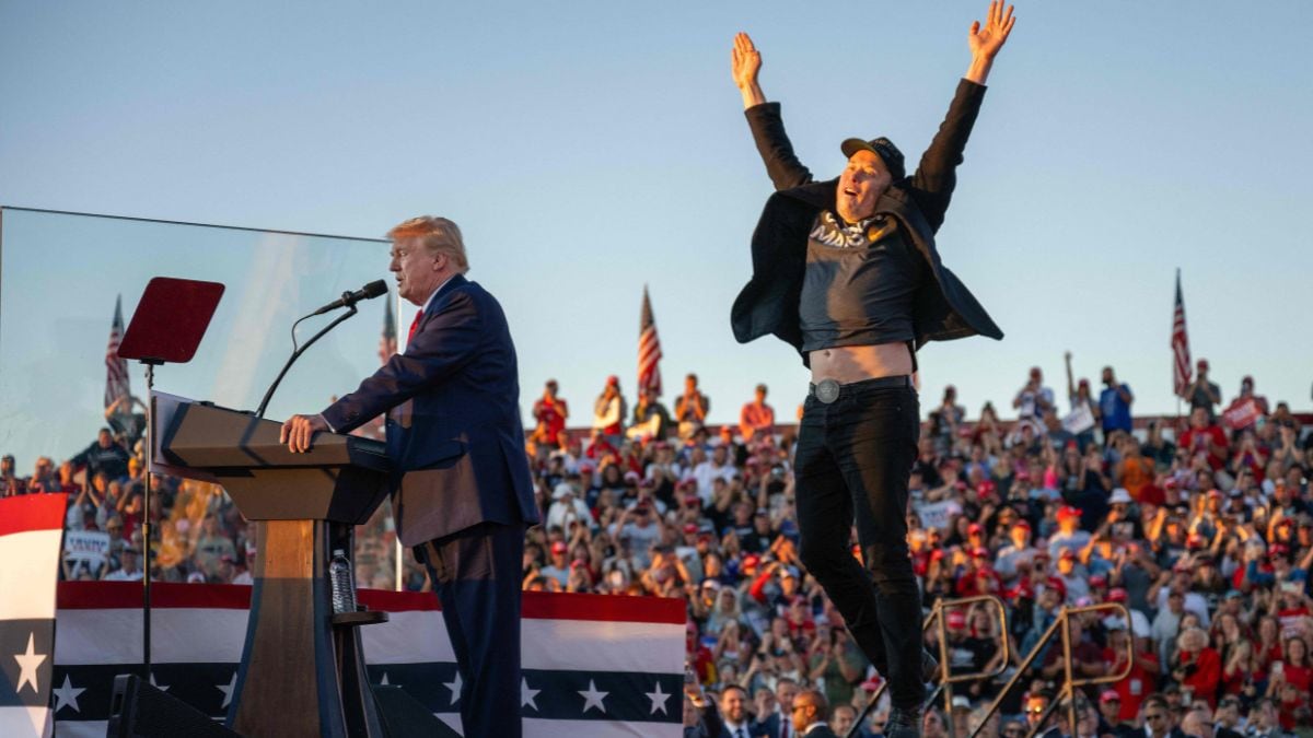 Elon Musk jumps on stage as he joins former US President and Republican presidential candidate Donald Trump | AFP