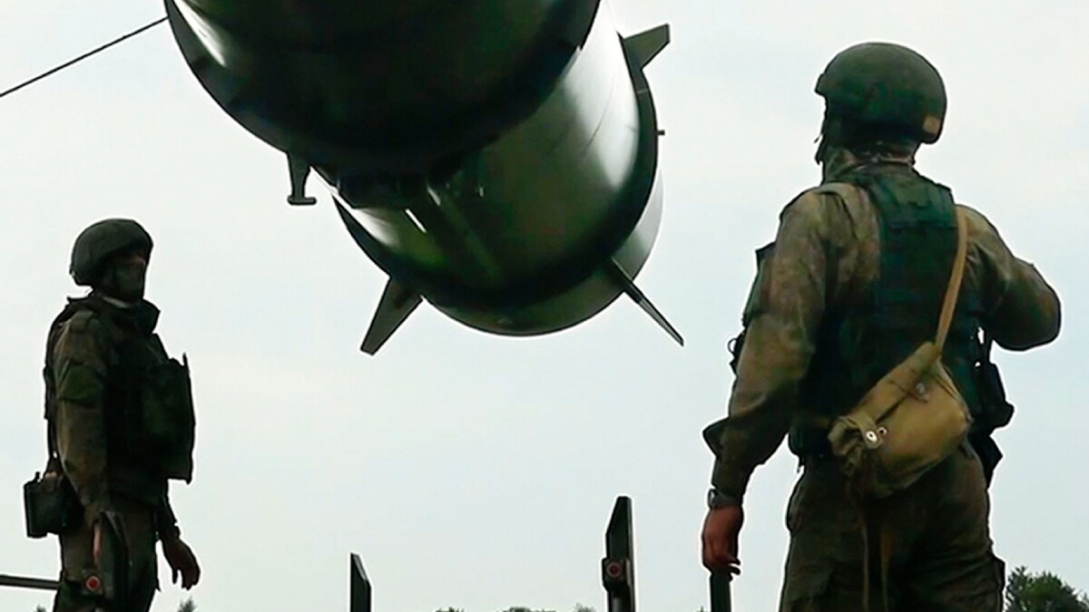  Russian soldiers load a Iskander-M short-range ballistic missile launchers at a firing position as part of Russian military drill intended to train the troops in using tactical nuclear weapons | AP 