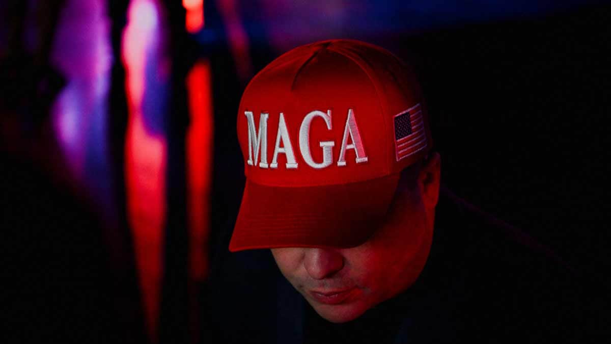 An attendee wears a MAGA (Make America Great Again) hat at Republican presidential nominee and former U.S. President Donald Trump's election night watch party in Florida | Reuters