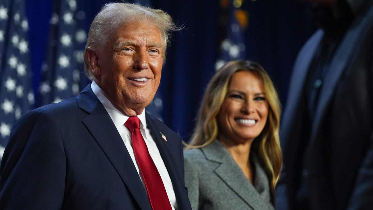 Republican presidential nominee former President Donald Trump and former first lady Melania Trump smile at an election night watch party at the Palm Beach Convention Center | AP 