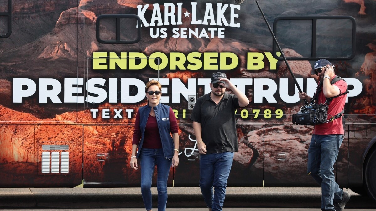 Arizona Republican U.S. Senate candidate Kari Lake (L) arrives to the Mesa Convention Centere | AFP