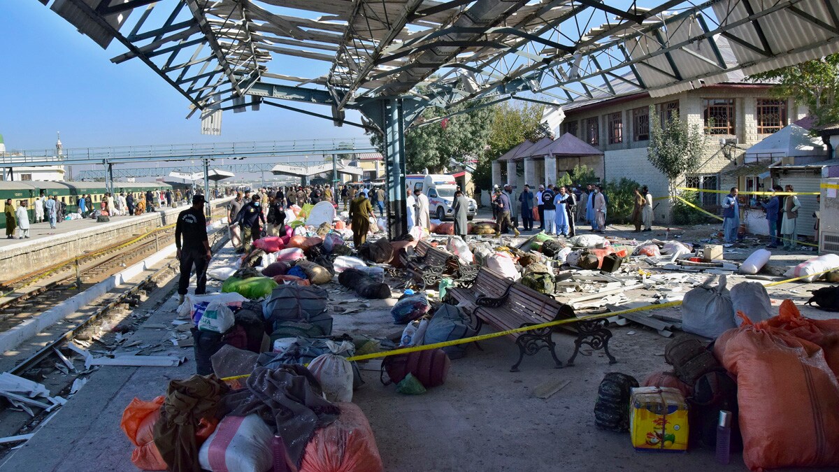 Security officials examine the site of a bomb explosion at railway station in Quetta, southwestern Pakistan, Saturday, Nov. 9, 2024. (AP Photo/Arshad Butt)