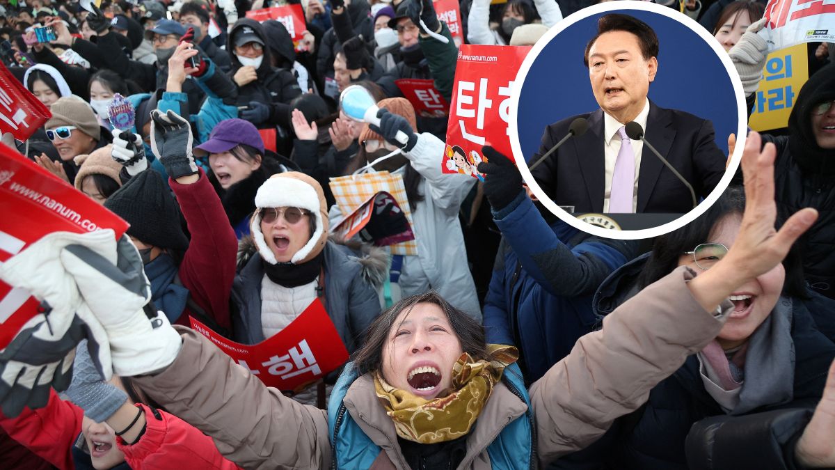 People celebrate after South Korean parliament passed a second impeachment motion against President Yoon Suk Yeol