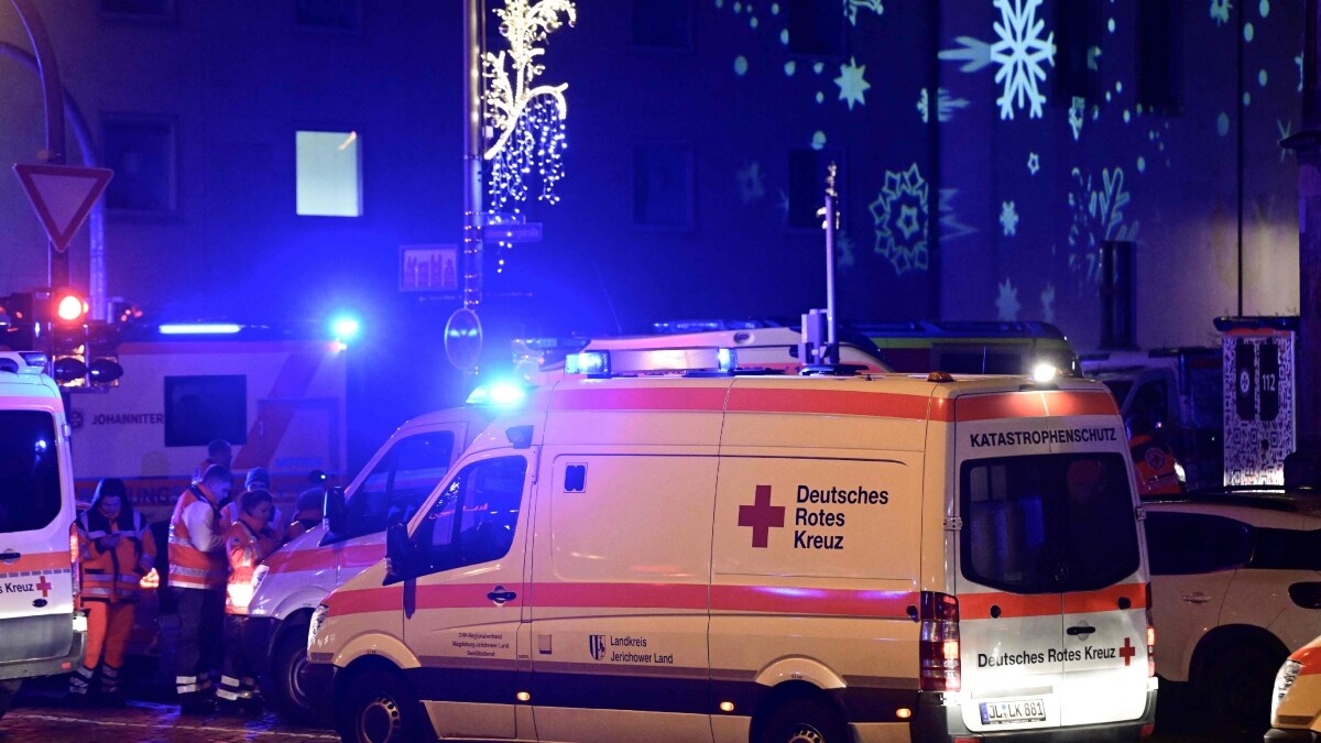 Ambulances and rescuers are seen after a car crashed into a crowd at a Christmas market injuring more than 60 people on December 20, 2024 in Magdeburg, eastern Germany | AFP