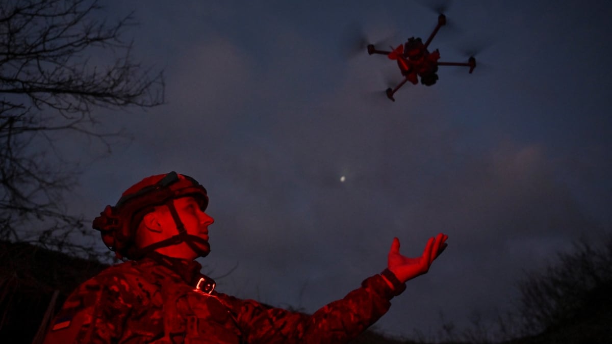 A member of Сonsolidated Brigade 'Khyzhak' (Predator) of the Ukrainian Patrol Police Department launches a drone at a position in a front line near the town of Toretsk amid Russia's attack | Reuters