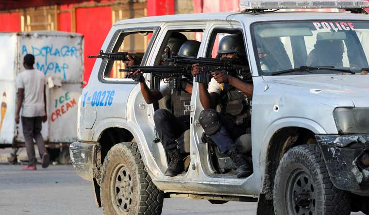 Police officers take part in a confrontation with gangs near the National Palace, in Port-au-Prince, Haiti | Reuters