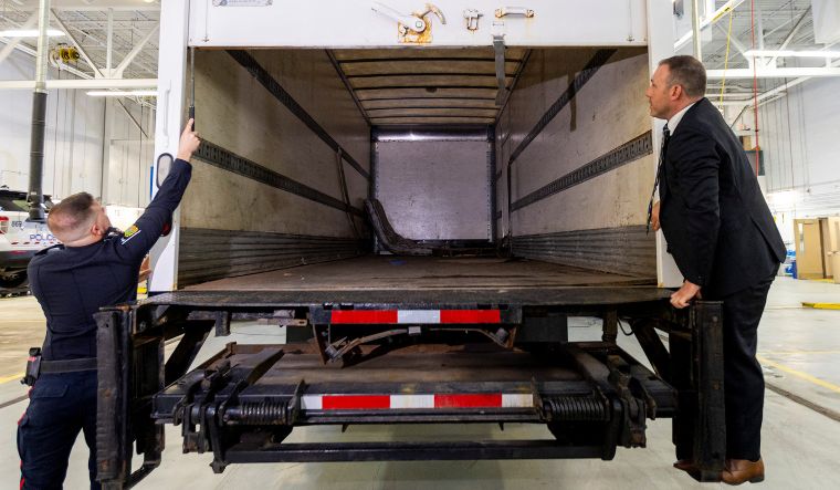 Police officers open the back of the truck used in the heist at Toronto Pearson International Airport, at a news conference in Brampton, Ontario, Canada April 17, 2024 | Reuters