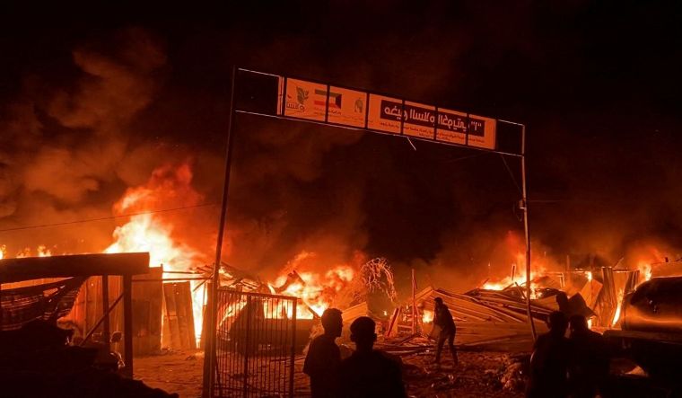 Fire rages following an Israeli strike on an area designated for displaced Palestinians, amid the ongoing conflict between Israel and Hamas, in Rafah in the southern Gaza Strip, in this still picture taken from a video | Reuters