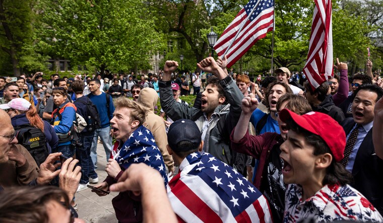 Pro-Palestine protesters clash with counter-protesters at the encampment in the quad at the University of Chicago on the South Side, Friday, May 3, 2024. (Ashlee Rezin/Chicago Sun-Times via AP)