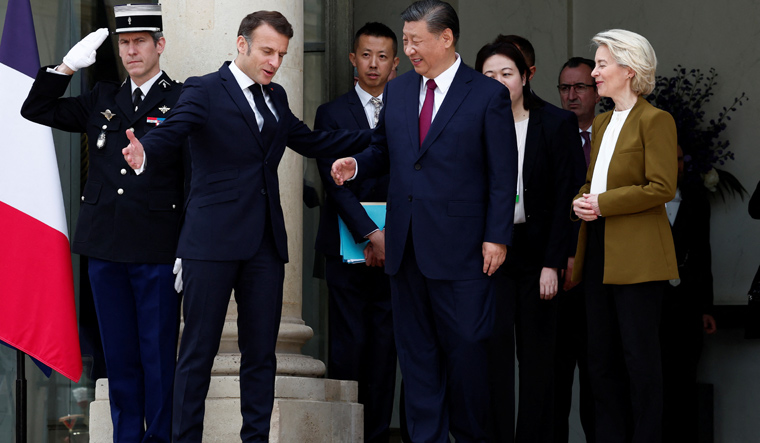 French President Emmanuel Macron and European Commission President Ursula von der Leyen accompany China's President Xi Jinping as he leaves after a trilateral meeting at the Elysee Palace in Paris as part of the Chinese president's two-day state visit in France | Reuters