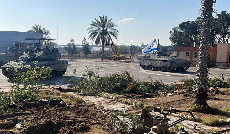 Israeli military vehicles operate in the Gazan side of the Rafah Crossing, amid the ongoing conflict between Israel and Palestinian Islamist group Hamas, in the southern Gaza Strip | Reuters