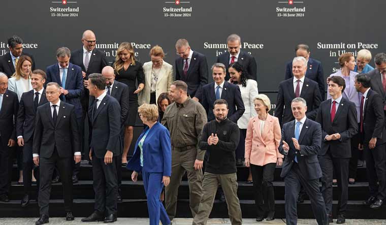 Ukraine's President Volodymyr Zelenskyy applauds after an official family photo session during the Ukraine peace summit in Obbrgen, Switzerland | AP