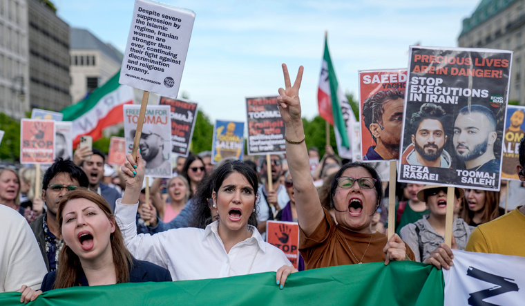 (File) Protesters attend a rally against a death sentence given to Toomaj Salehi, a popular rapper in Iran and to support to the women of Iran, in Berlin, Germany | AP